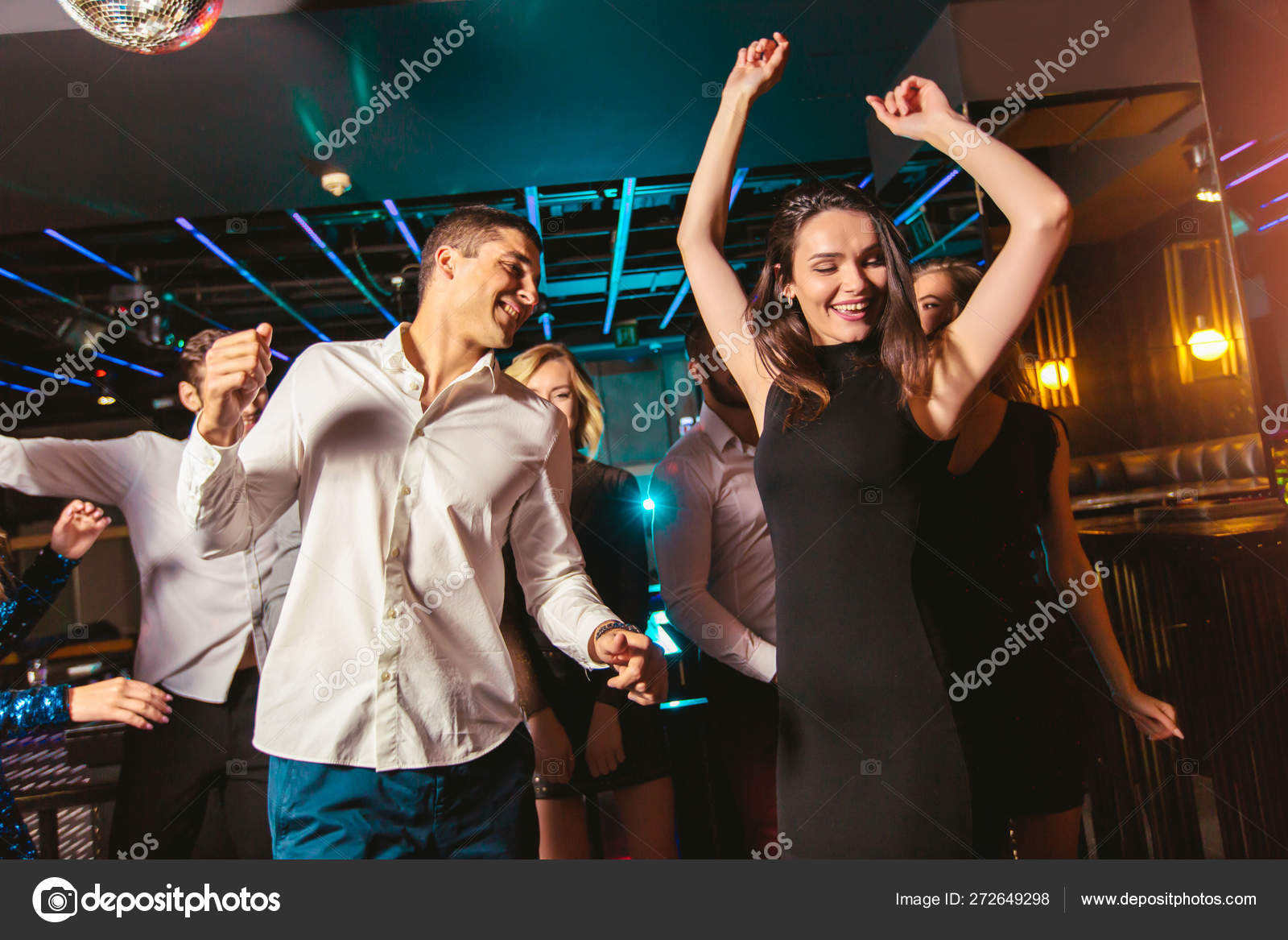 Young happy people are dancing in club. Nightlife and disco conc Stock ...