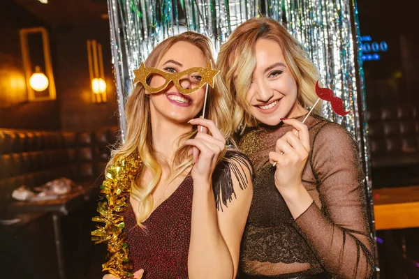 Girls celebrating new years eve at the nightclub. Group of femal