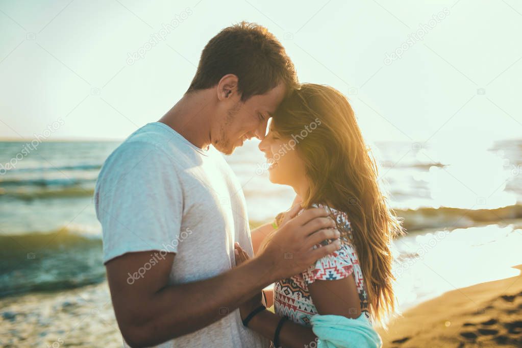 Romantic young couple enjoying summer holidays. Handsome young m