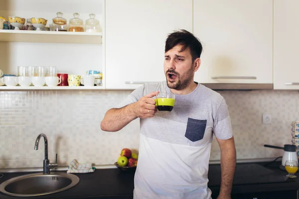 Handsome man on kitchen drinking coffee in the morning. — Stock Photo, Image