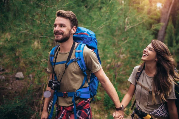 Backpackers hiking on the path in mountains — Stock Photo, Image