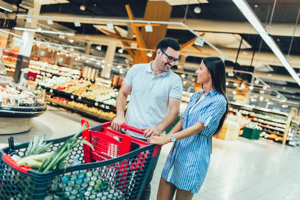 Happy young couple bonding to each other and smiling while walki — Stock Photo, Image