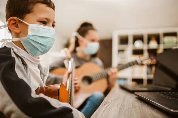 Boy Girl Wear Protective Masks Playing Acoustic Guitar Watching Online — Stock Photo, Image