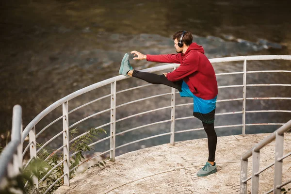 Young Male Athlete Stretching Next River Morning Work Out — Stock Photo, Image