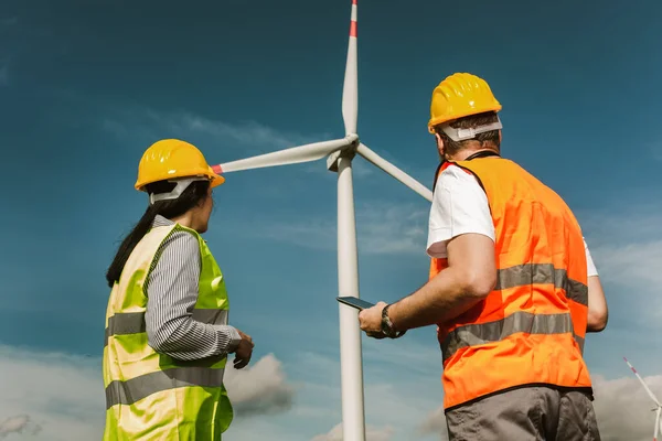 Windmill engineers inspection and progress check wind turbine