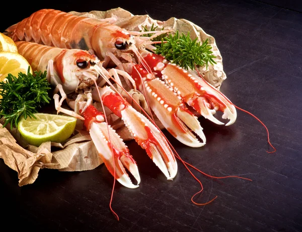 Two Big Delicious Raw Langoustines Rosemary Lemon Lime Parchment Paper — Stock Photo, Image