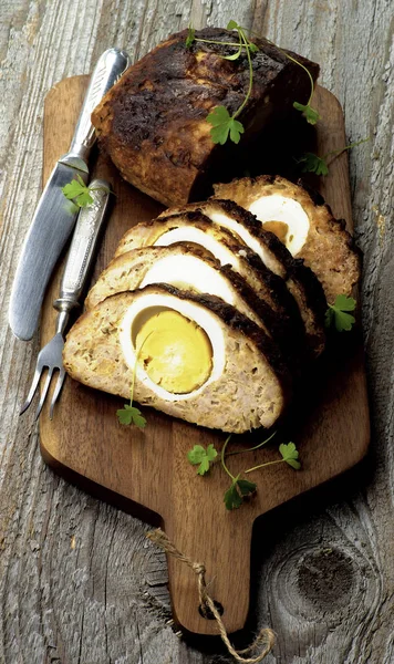 Slices Homemade Meatloaf Stuffed Boiled Eggs Cutting Board Knife Fork — Stock Photo, Image