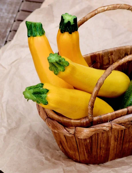 Four Fresh Yellow Zucchini Basket Closeup Parchment Paper — Stock Photo, Image