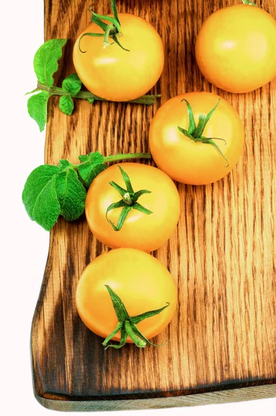 Arrangement Fresh Ripe Yellow Tomatoes Twigs Leafs Closeup Wooden Board — Stock Photo, Image