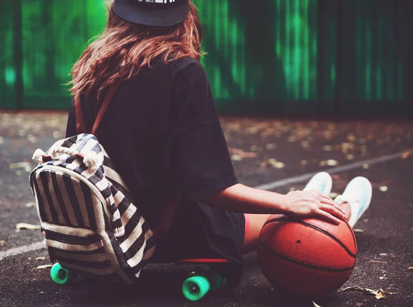 Closeup Photo Basketball Ball Girl Sitting Plastic Orange Penny Shortboard — Stock Photo, Image