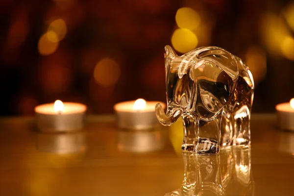 Glass Elephant Figure Wax Gold Bokeh Reflection — Stock Photo, Image