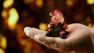 El Beyaz eldiven yılbaşı oyuncak Noel Baba altın bokeh hd ayak 