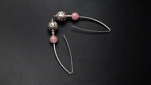 Silver Earrings Punch Pink Agate Stone Footage Dark Leather Background — Stock Video