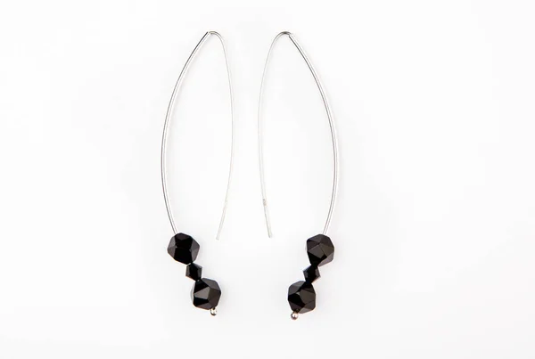 silver earrings black obsidian stone white background nobody