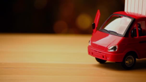 Toy Car Wooden Table Gold Bokeh Footage — Stock Video
