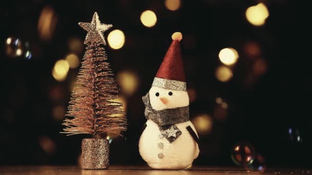 Textile Snowman Figure Gold Bokeh Soap Bubbles Footage — Stock Video
