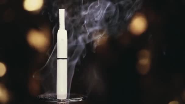 Electronic Smoke Device Gold Bokeh Nobody Footage — Stock Video