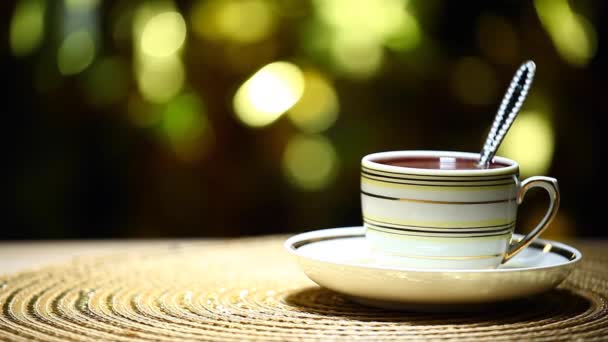 One Hot Tea Cup Spoon Gold Bokeh Nobody Footage — Stock Video