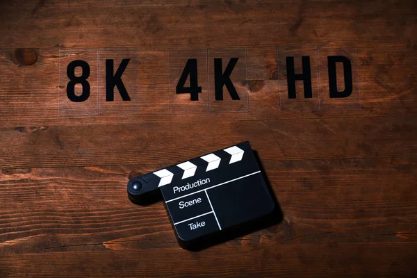 video film clapper board wooden table