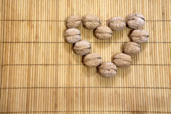 Walnut Heart Symbol Wooden Background — Stock Photo, Image