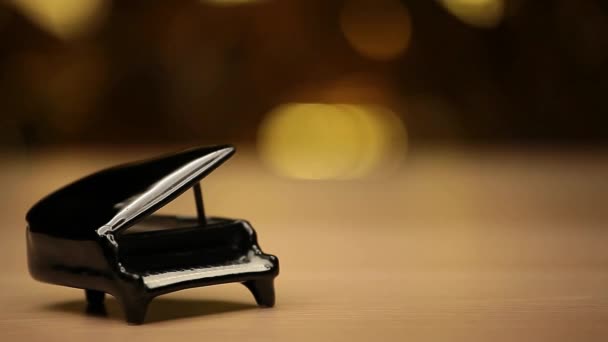 Piano Wooden Table Gold Bokeh — Stock Video