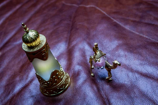 Glass Perfume Bottle Camel Leather Background — Stock Photo, Image