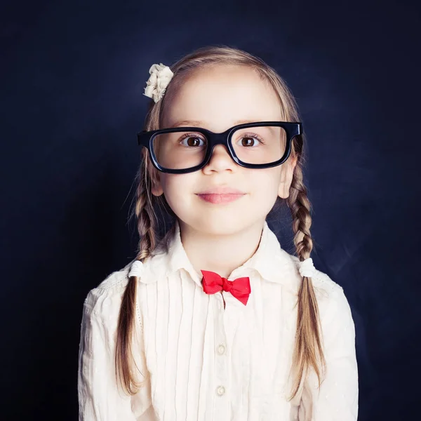 Smiling Little Girl Glasses Blue Chalkboard Background Smart Child Back — Stock Photo, Image