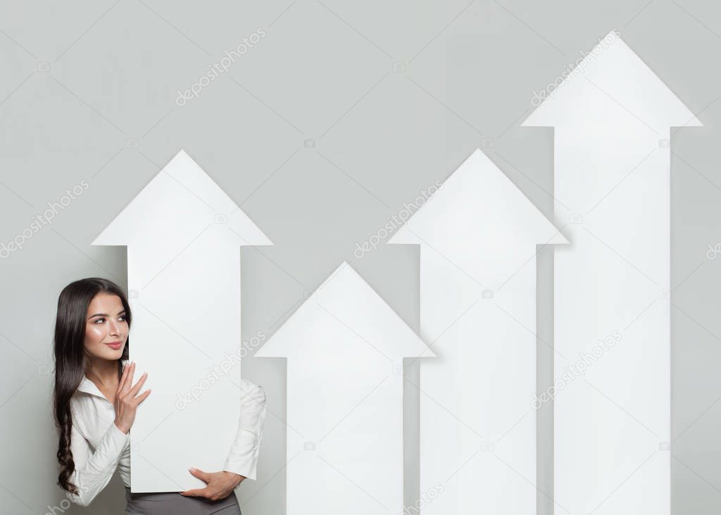 Business Manager with Rising Arrow Columns, Representing Business Growth. Business Success and Shares Up Concept. 