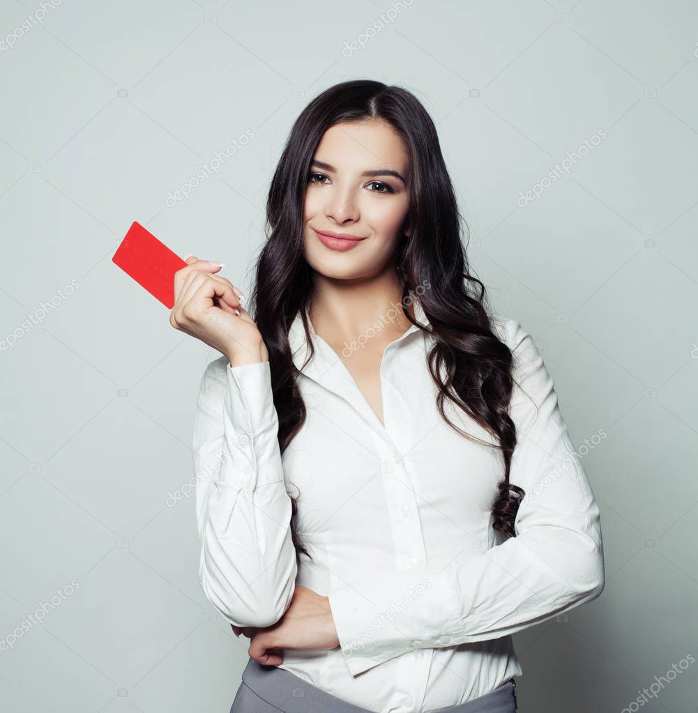Successful business woman showing red empty card, business, advertising marketing and product placement concept