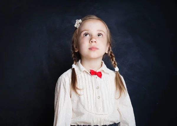 Cute Little Girl Looking Blackboard Background — Stock Photo, Image