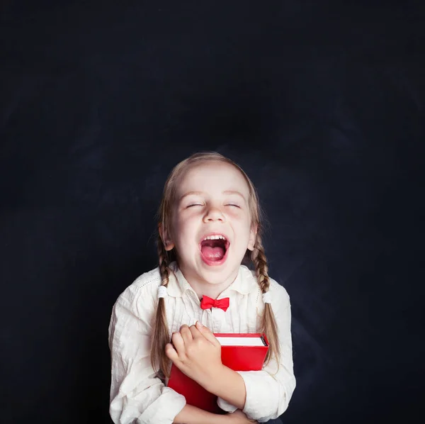 Happy Little Girl Laughing Happy Child Red Book Empty Blackboard — Stock Photo, Image