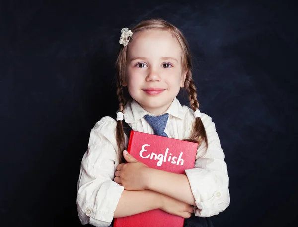 Menina Pequena Abraçando Livro Inglês Contra Fundo Quadro Negro Sala — Fotografia de Stock