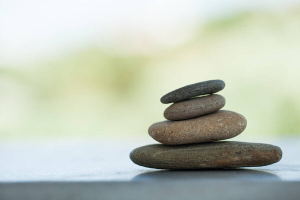 Group of stones on white background with sunlight