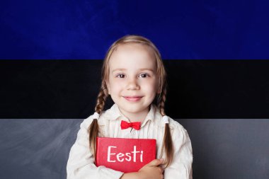 Estonian language concept with litte girl student with book against the Estonian flag background. Learn language clipart