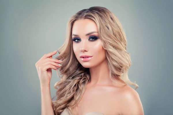 Perfect blonde woman with long curly hair and makeup on banner background