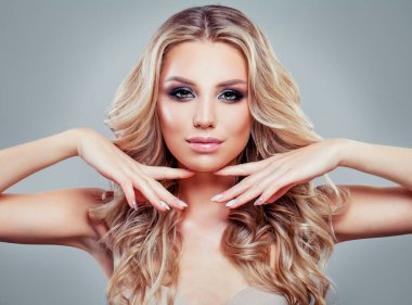 Perfect blonde woman face. Model with long healthy curly hair and makeup clipart
