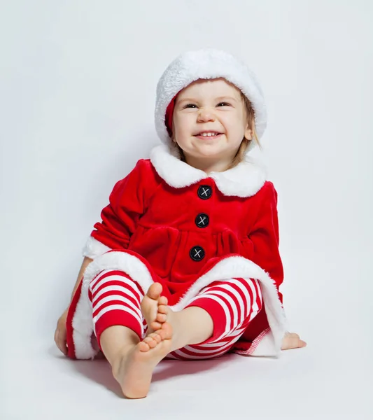 Dziecko Boże Narodzenie Santa Kapeluszu Siedzi Białym Tle — Zdjęcie stockowe
