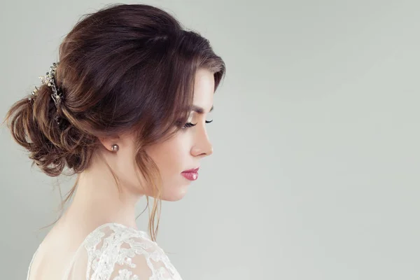 Charming woman with bridal hairstyle and hairdeco, portrait