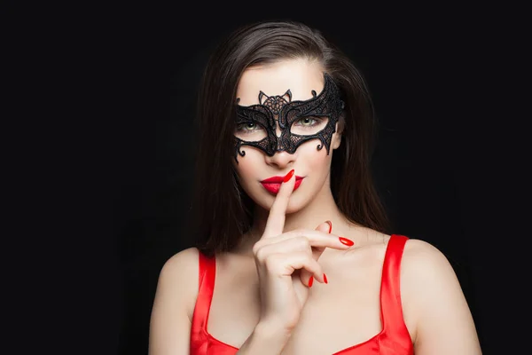 Pretty girl fashion model in black mask smiling, portrait