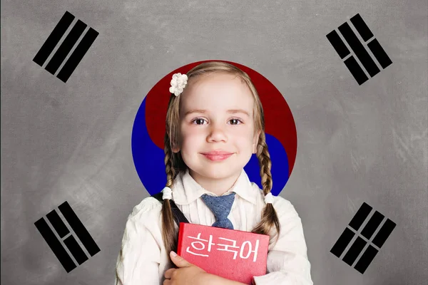South Korea concept with kid little girl student with red book against the South Korea flag background. Learn south korean language