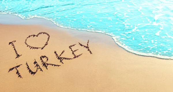 Turkey holidays concept. The inscription on the sand by the sea