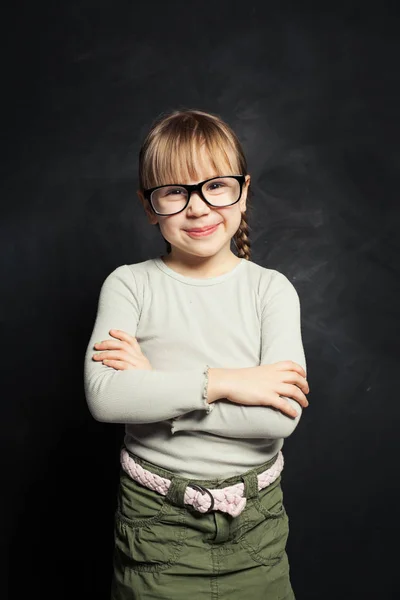 Happy child girl portrait. Smiling smart kid in glasses — Stock Photo, Image