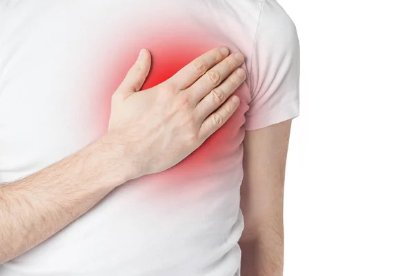 Man in white t-shurt having heart pain. Man holding his hand to his chest and having heart pain — Stock Photo, Image