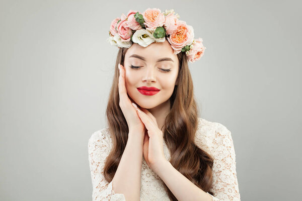 Portrait of pretty young woman with healthy skin, hair and red lips