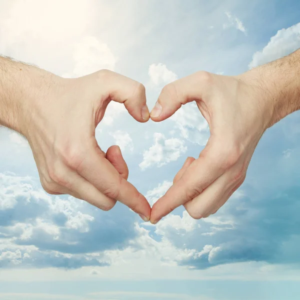 Mans hand make heart shape on white background — Stock Photo, Image