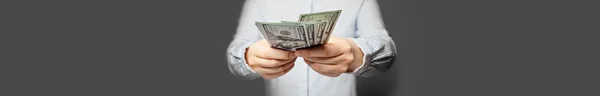 Banner with hands holding cash money US dollars banknote — Stock Photo, Image