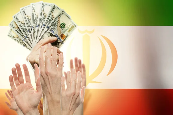 People raising hands with dollars and flag Iran on background.