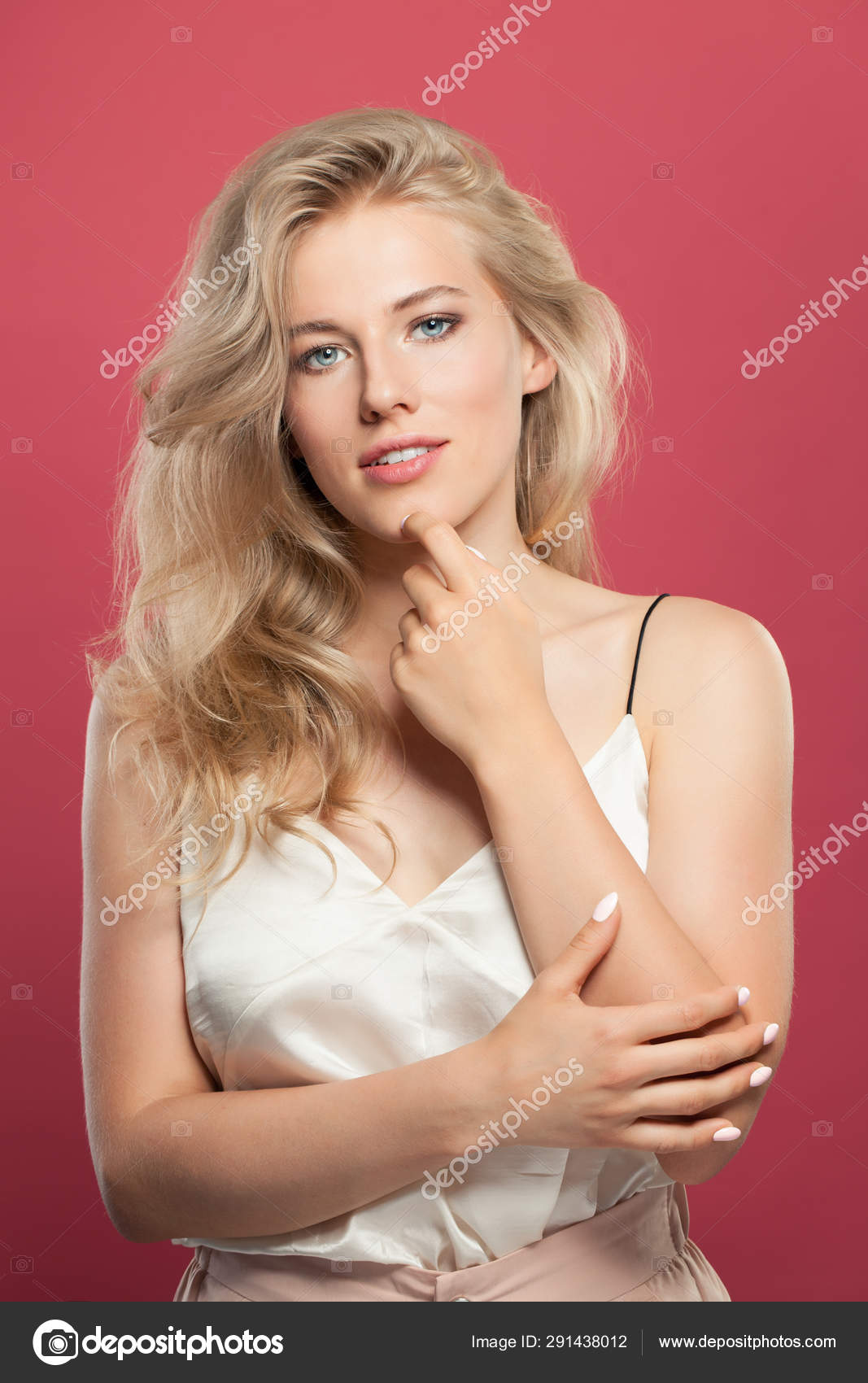 Natural Blonde Woman With Long Hair On Pink Background Stock