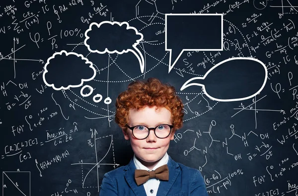 Redhead little boy with empty speech clouds bubbles and science — Stock Photo, Image