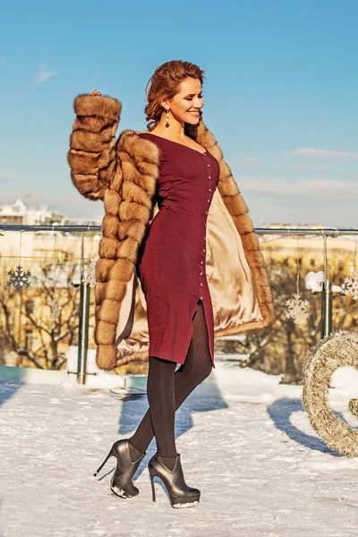Happy winter woman fashion model outdoors